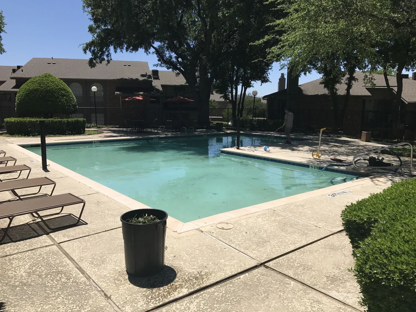 Technician servicing a commercial pool