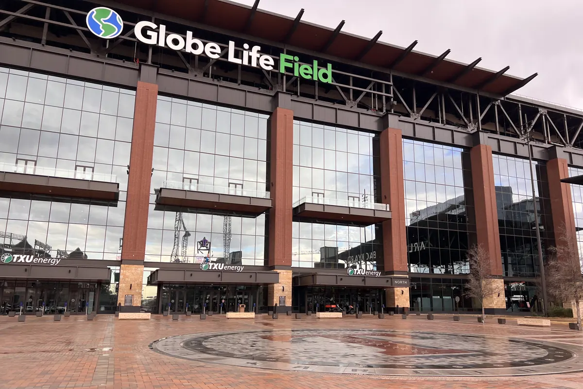 Front of Globe Life Field in Arlington with the paved fountain plaza and inlaid medallion in front, fountains off