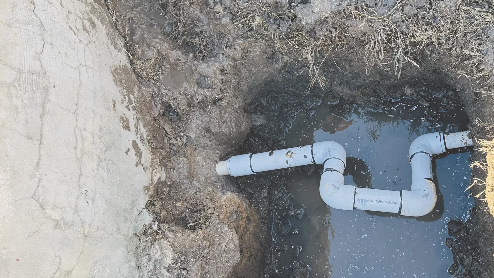 After: new PVC pipe installed.