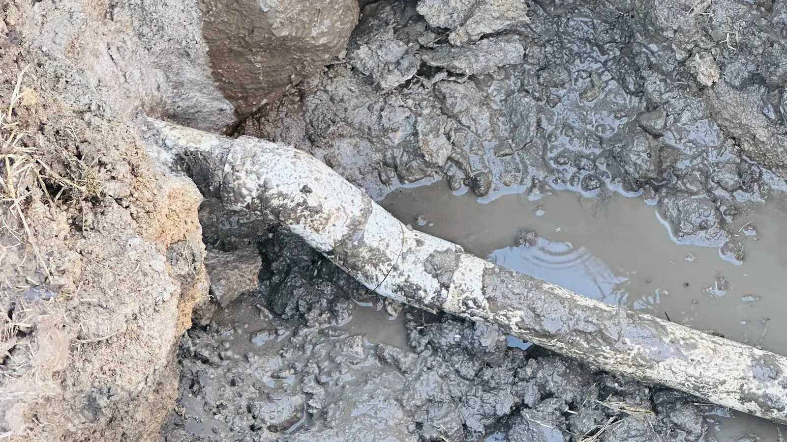 Before: broken underground pool pipe found during a leak repair.