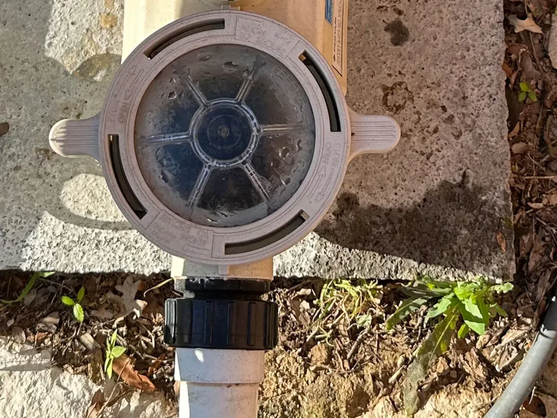 Pump strainer lid and suction-side union before a suction leak repair