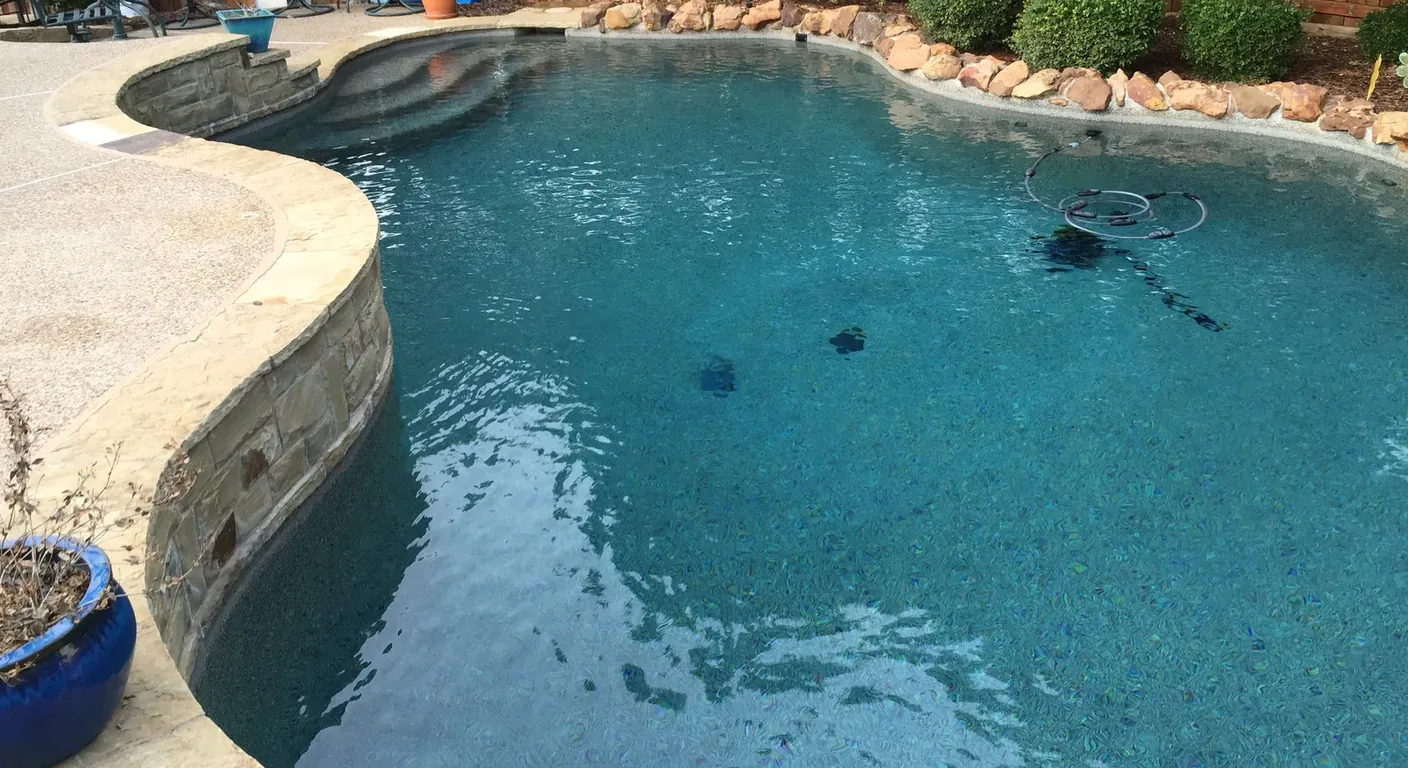 Clear blue pool water after a Lucent Pools green clean.